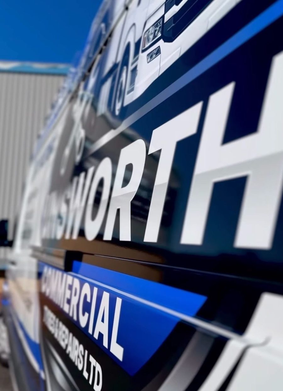 Signwriting on the side of an Unsworth Commercial service van.